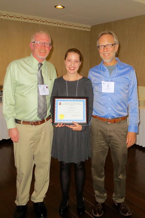 Casey Mueller (middle) receiving the New Investigator Award. She is receiving the award from the Comparative and Evolutionary Physiology section Chair, Dr. Michael Hedrick (left) and this year's Krogh Awardee Dr. Jon Harrison (right)
