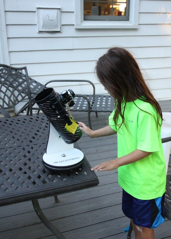 SteelyKid with her new telescope.