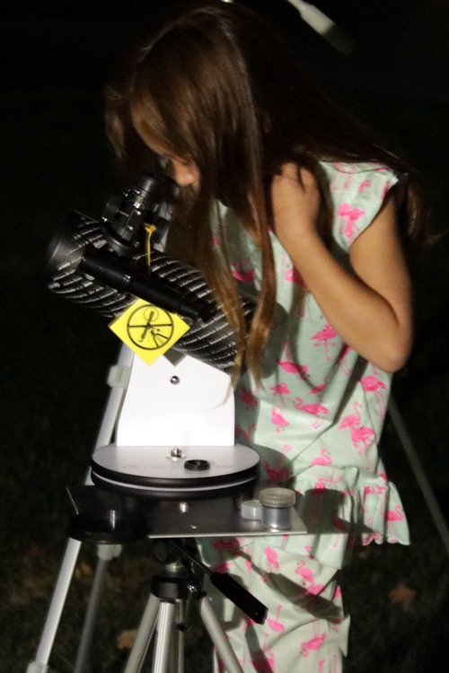 SteelyKid looking at the eclipse through her telescope.