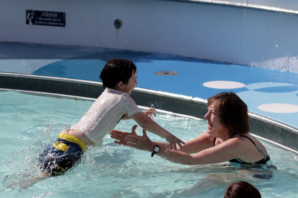 The Pip jumping to Grandma in the wading pool on the ship.