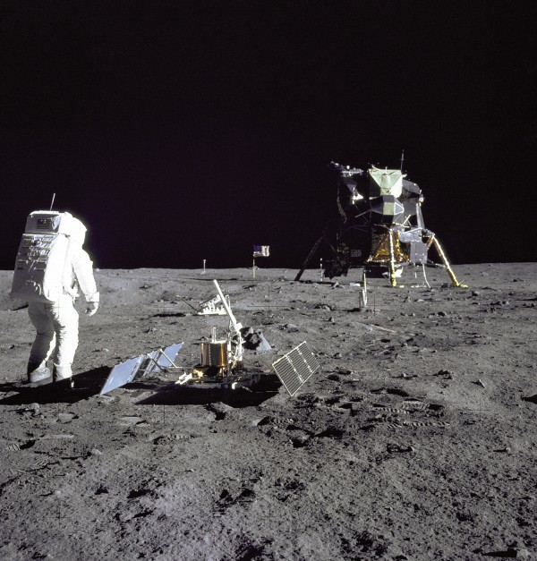 Buzz Aldrin installing the first seismometer on the Moon