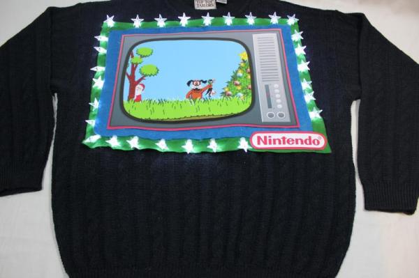 Image credit: via http://www.christmassweaters.ca/feature-xmas-sweaters/duck-hunt-christmas-sweater/.