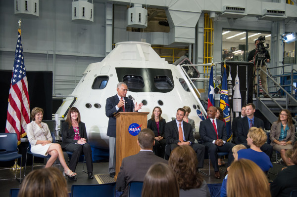 Image credit: NASA; Photographer: Robert Markowitz. NASA Administrator Charlie Bolden, at lectern in the middle of the frame, speaks at a special media-day program at the Johnson Space Center’s Space Vehicle Mock-up Facility on Aug. 20, during which the 2013 class of astronaut candidates was introduced.