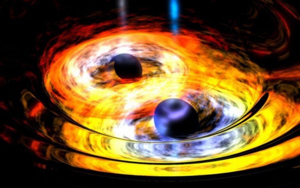 Artist's impression of two merging black holes, with accretion disks. The density and energy of the matter here is woefully insufficient to create gamma ray or X-ray bursts. Image credit: NASA / Dana Berry (Skyworks Digital).