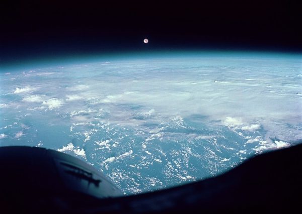Moon and clouds over the Pacific Ocean, as photographed by Frank Borman and James A. Lovell during the Gemini 7 mission. Image credit: NASA.