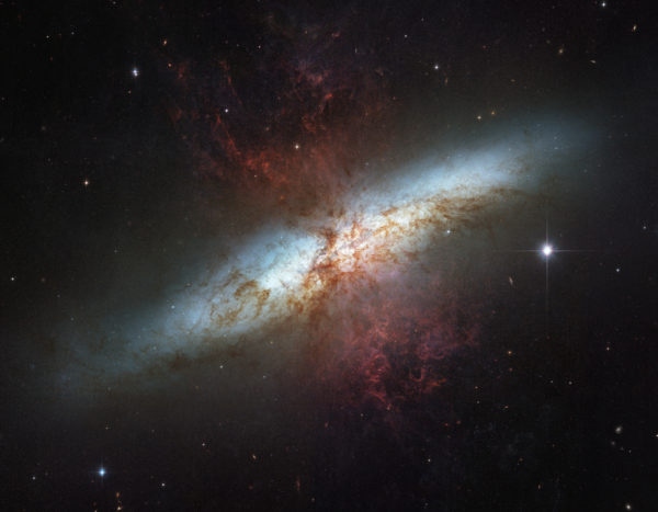 The Cigar Galaxy, M82, and its supergalactic winds that would drive all this matter out of the galaxy itself, were it not for dark matter. Image credit: NASA, ESA, The Hubble Heritage Team, (STScI / AURA); Acknowledgement: M. Mountain (STScI), P. Puxley (NSF), J. Gallagher (U. Wisconsin).