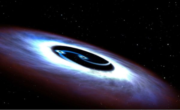 A double black hole. Image credit: NASA, ESA and G. Bacon (STScI).