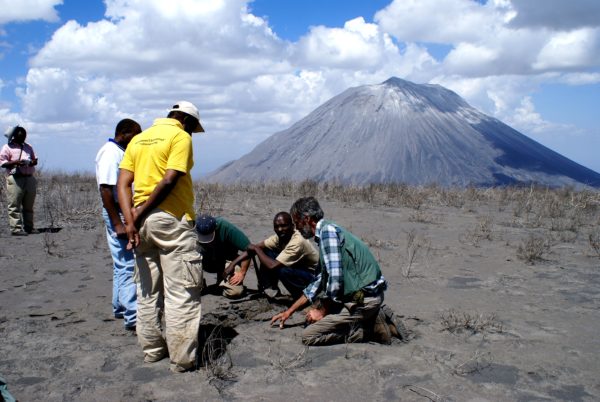 Scientists studying the ash from a recent eruption of Ol Doinyo Lengai volcano in Tanzania. Public domain photo.