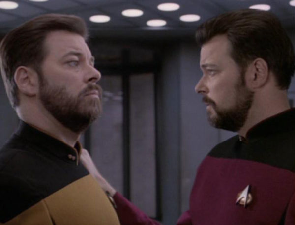 Tom and Will Riker, together on the Enterprise after the former's rescue. Image credit: Memory Alpha Wiki, by user ThomasHL, from the TNG episode Second Chances.