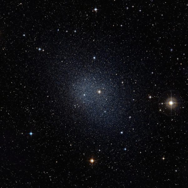 Dwarf galaxies, like the one imaged here, have a much greater than 5-to-1 dark matter to normal matter ratio, as bursts of star formation have expelled much of the normal matter. Image credit: ESO / Digitized Sky Survey 2.