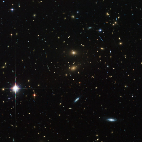 Galaxy cluster LCDCS-0829, as observed by the Hubble Space Telescope. This galaxy cluster is speeding away from us, and in only a few billion years will become unreachable, even at the speed of light. Image credit: ESA/Hubble & NASA.