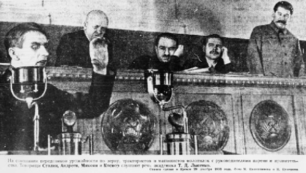 Trofim Lysenko (L), speaking at the Kremlin with Joseph Stalin (R) looking on in 1935.