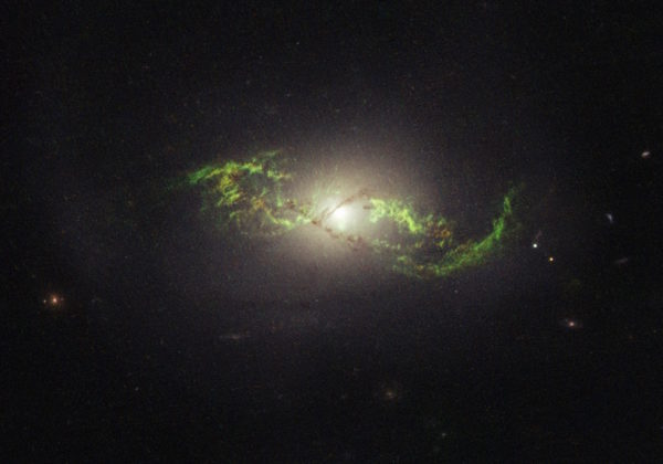 Some rare galaxies exhibit a green glow thanks to the presence of doubly ionized oxygen. This requires UV light from stellar temperatures of 50,000 K and above. Image credit: NASA, ESA, and W. Keel (University of Alabama, Tuscaloosa), of NGC 5972.