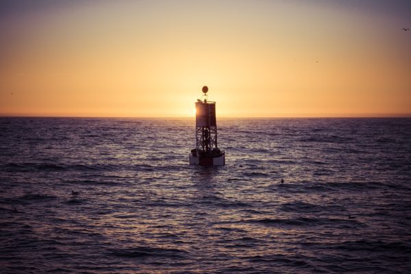 When you're at the optimal distance to measure the Earth's curvature, a buoy's bottom will be visible right on the horizon line. For a human at sea level, that will never be as much as six kilometers from the buoy. Image credit: mark_az of Pixabay.
