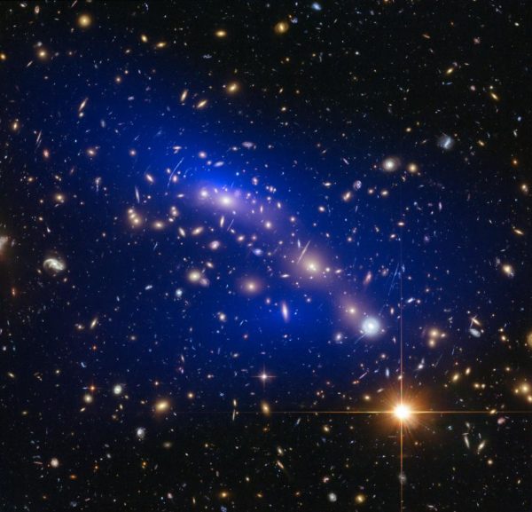 The ultramassive, merging dynamical galaxy cluster Abell 370, with gravitational mass (mostly dark matter) inferred in blue. It's all attractive. Image credit: NASA, ESA, D. Harvey (Swiss Federal Institute of Technology), R. Massey (Durham University, UK), the Hubble SM4 ERO Team and ST-ECF.
