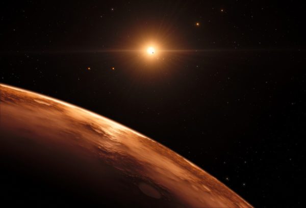 This artist’s impression shows the view just above the surface of one of the planets in the TRAPPIST-1 system, which may contain liquid water on the surface if the atmospheric conditions are right. Image credit: ESO/M. Kornmesser/spaceengine.org.