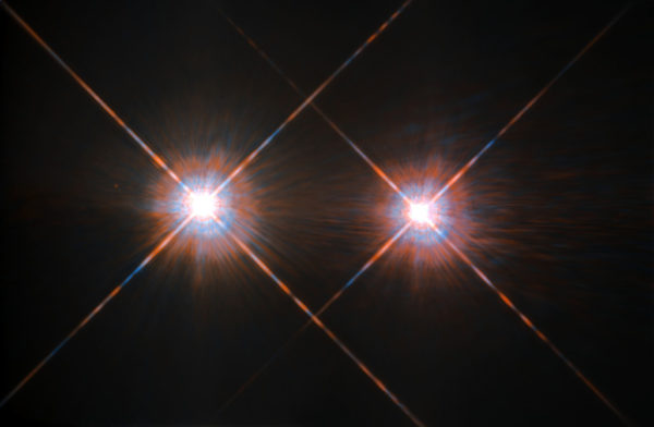 The two sun-like stars, Alpha Centauri A and B, are located just 4.37 light years away from us and orbit one another at between the distances of Saturn and Neptune in our own solar system. Each may house Earth-like planets. Image credit: ESA/Hubble and NASA.
