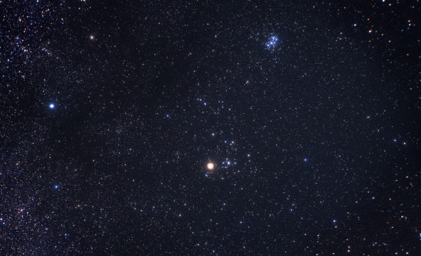 The constellation of Taurus is one of the leading candidate locations for the hypothesized Planet Nine. The bright star Aldebaran and the Hyades star cluster are the most easily identifiable objects to the naked eye in Taurus. Image credit: Akira Fujii.