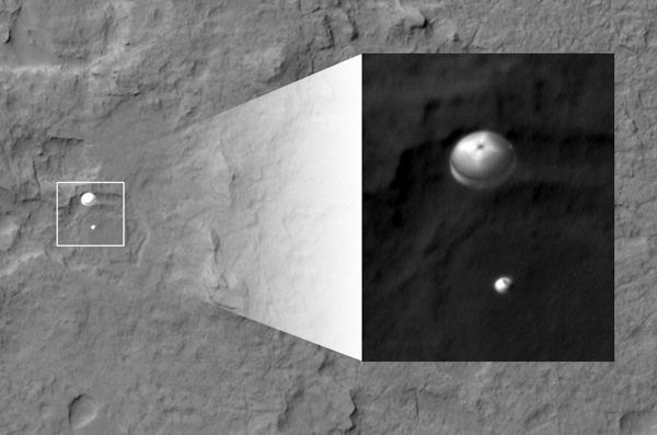 Satellite image of the Mars rover Curiosity parachuting toward the Martian surface